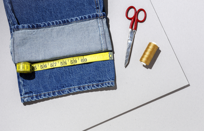 Levi jeans being measured for hemming.