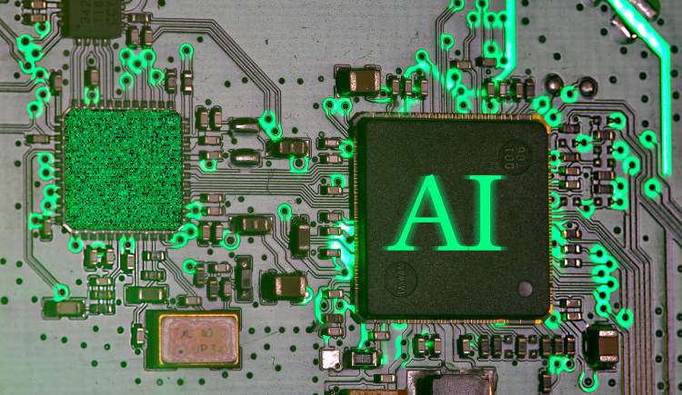 Close-up of a circuit board with glowing green traces highlighting components, including a central chip labeled ‘AI.