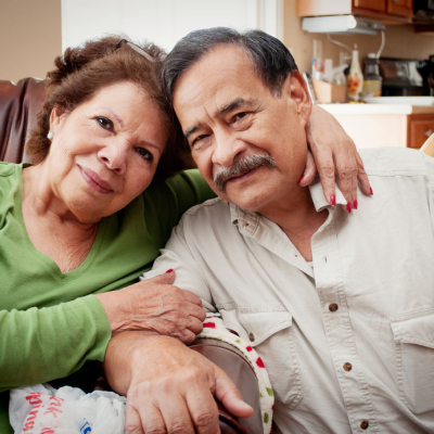An older couple posing for a photo together.
